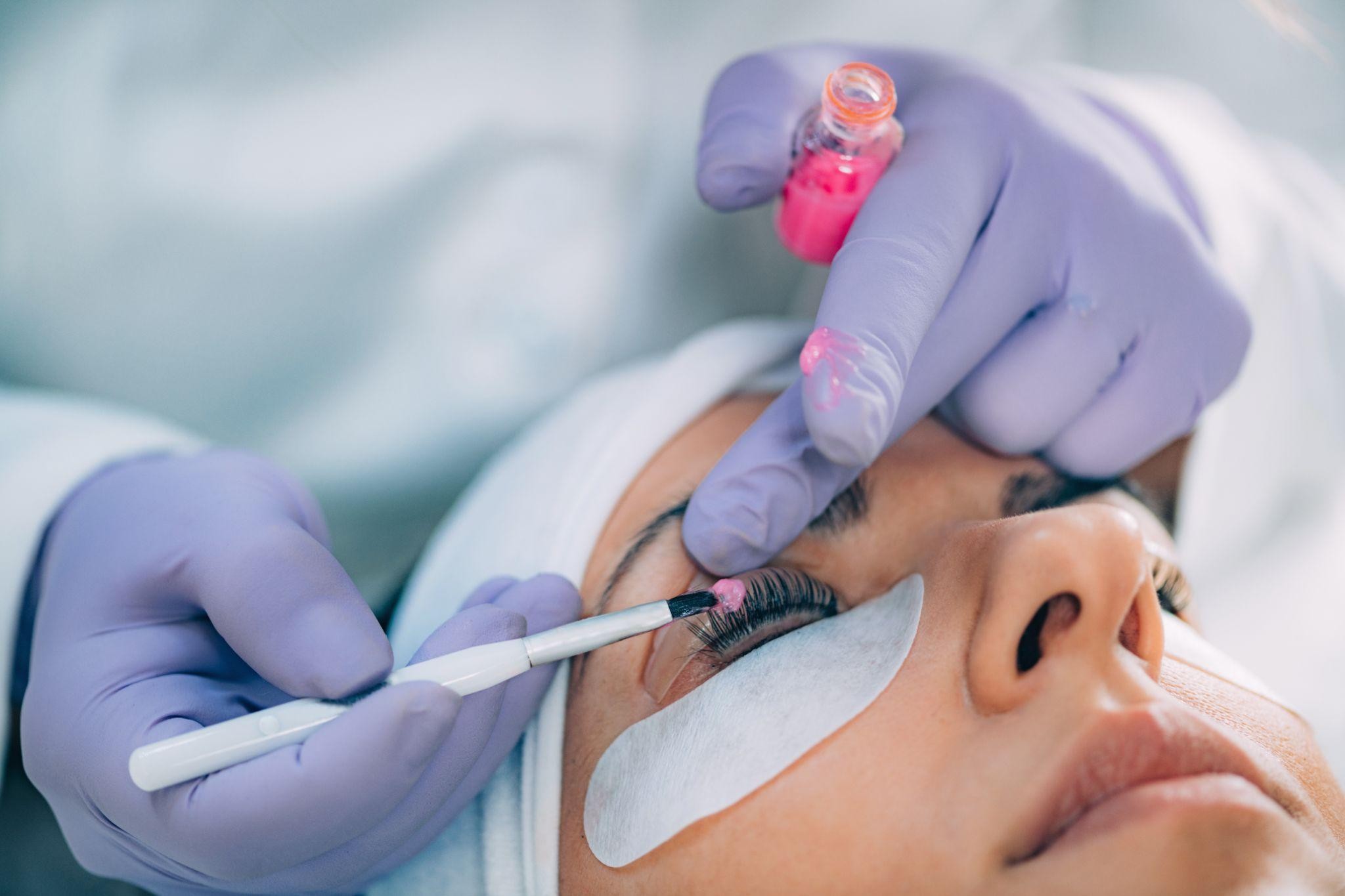 Professional performing a lash lift treatment in St. Petersburg, enhancing natural lashes as part of a microblading and lash lift beauty service.